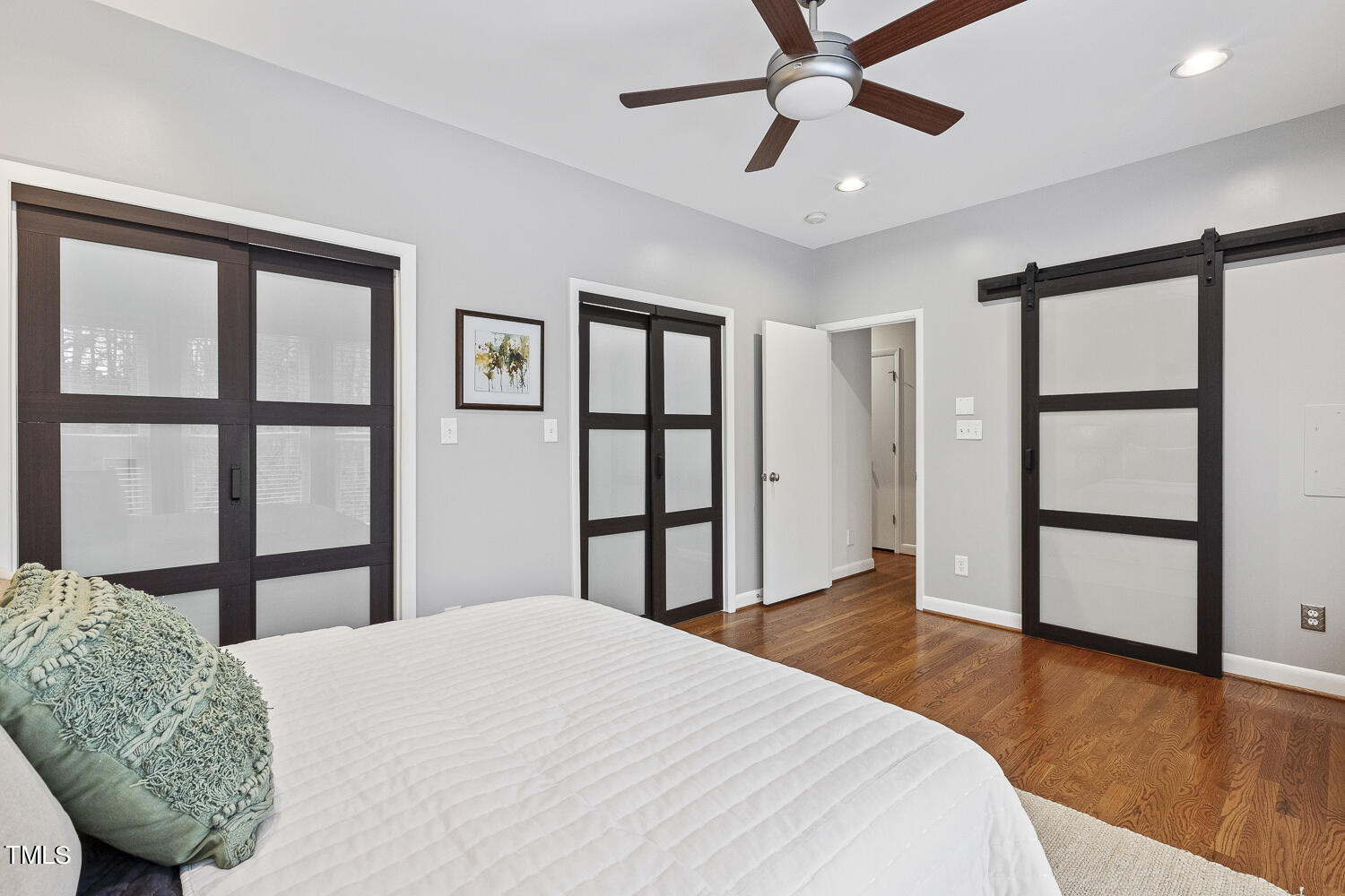805 The Village Circle Raleigh, NC 27615 - Photo 20 of 42 a bedroom with a bed dresser and a window