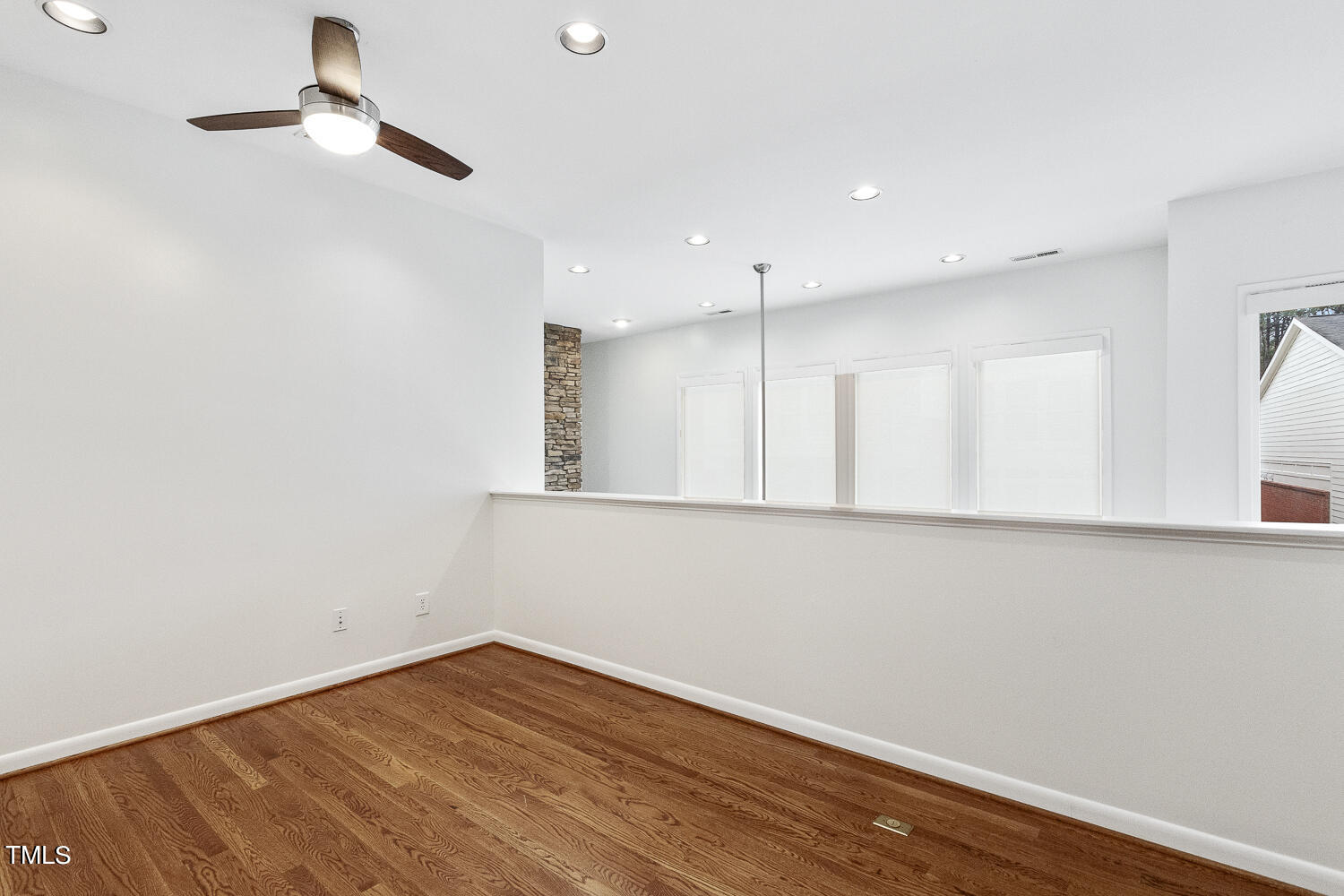 805 The Village Circle Raleigh, NC 27615 - Photo 27 of 42 a view of empty room with wooden floor and fan