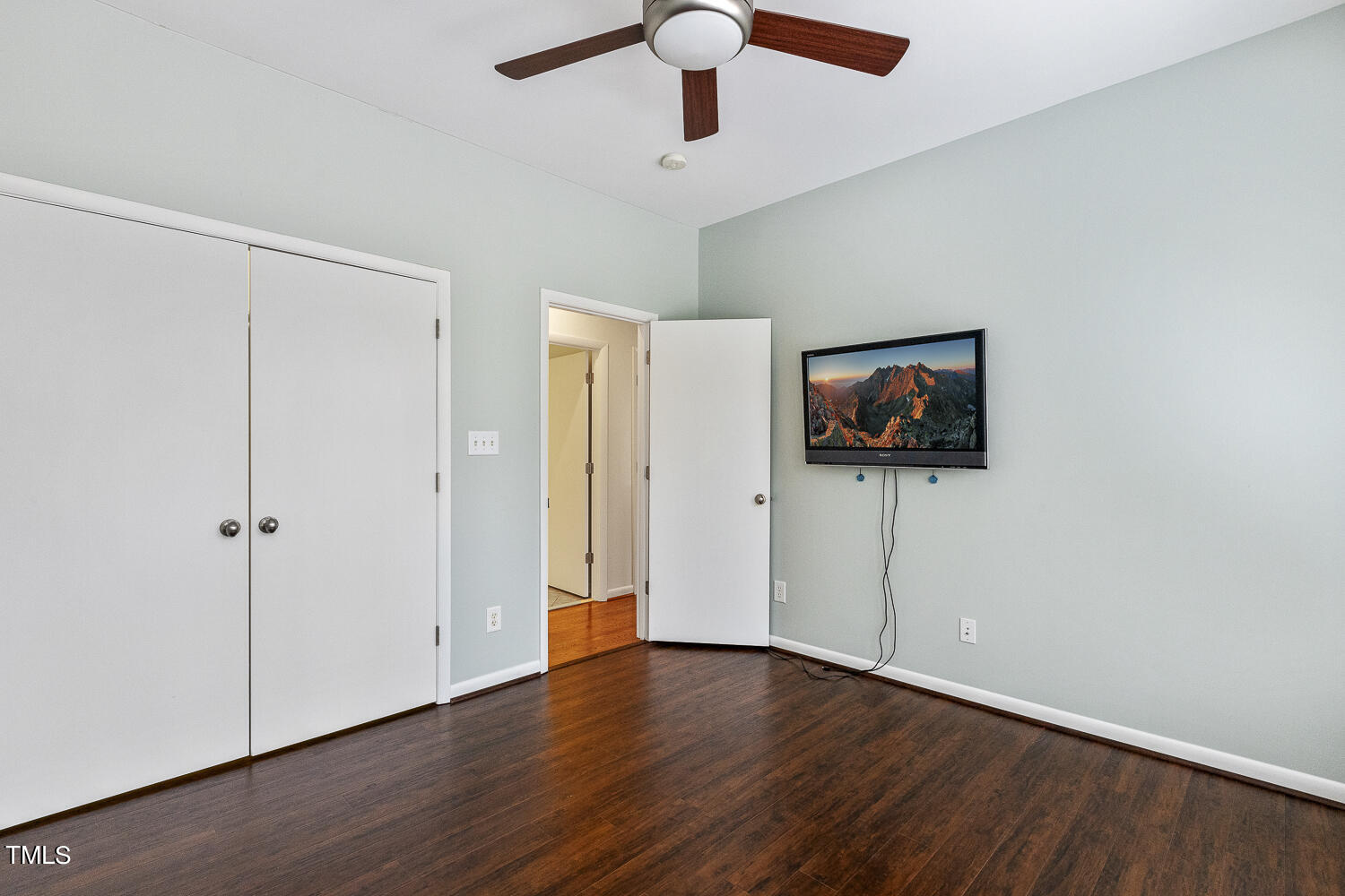 805 The Village Circle Raleigh, NC 27615 - Photo 31 of 42 a view of a room with wooden floor and fan