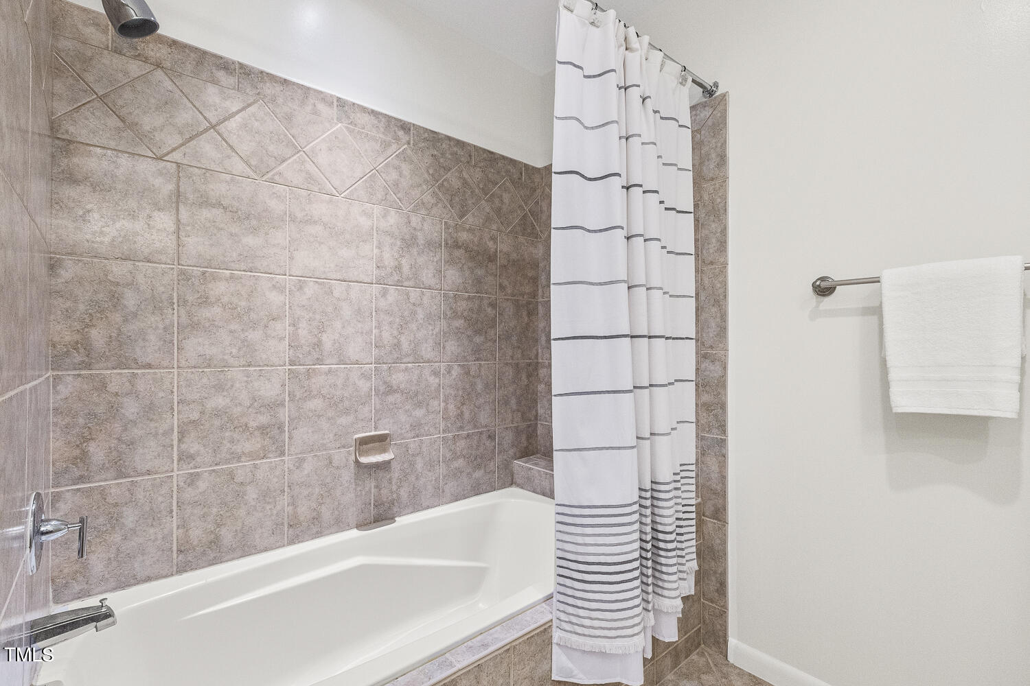 805 The Village Circle Raleigh, NC 27615 - Photo 33 of 42 a bathroom with a bathtub and shower