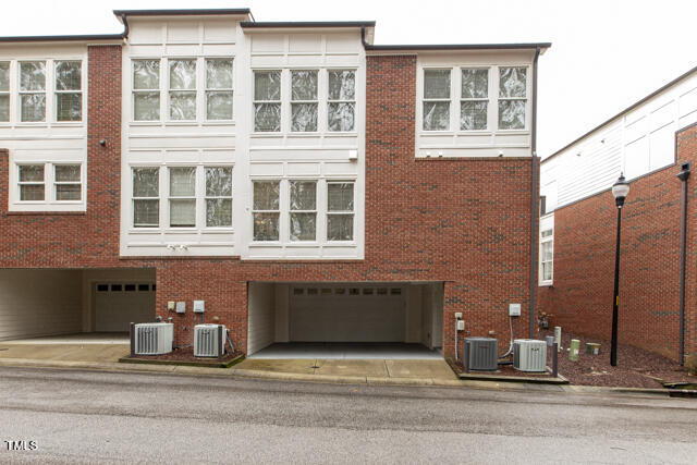805 The Village Circle Raleigh, NC 27615 - Photo 36 of 42 a view of a brick building with many windows