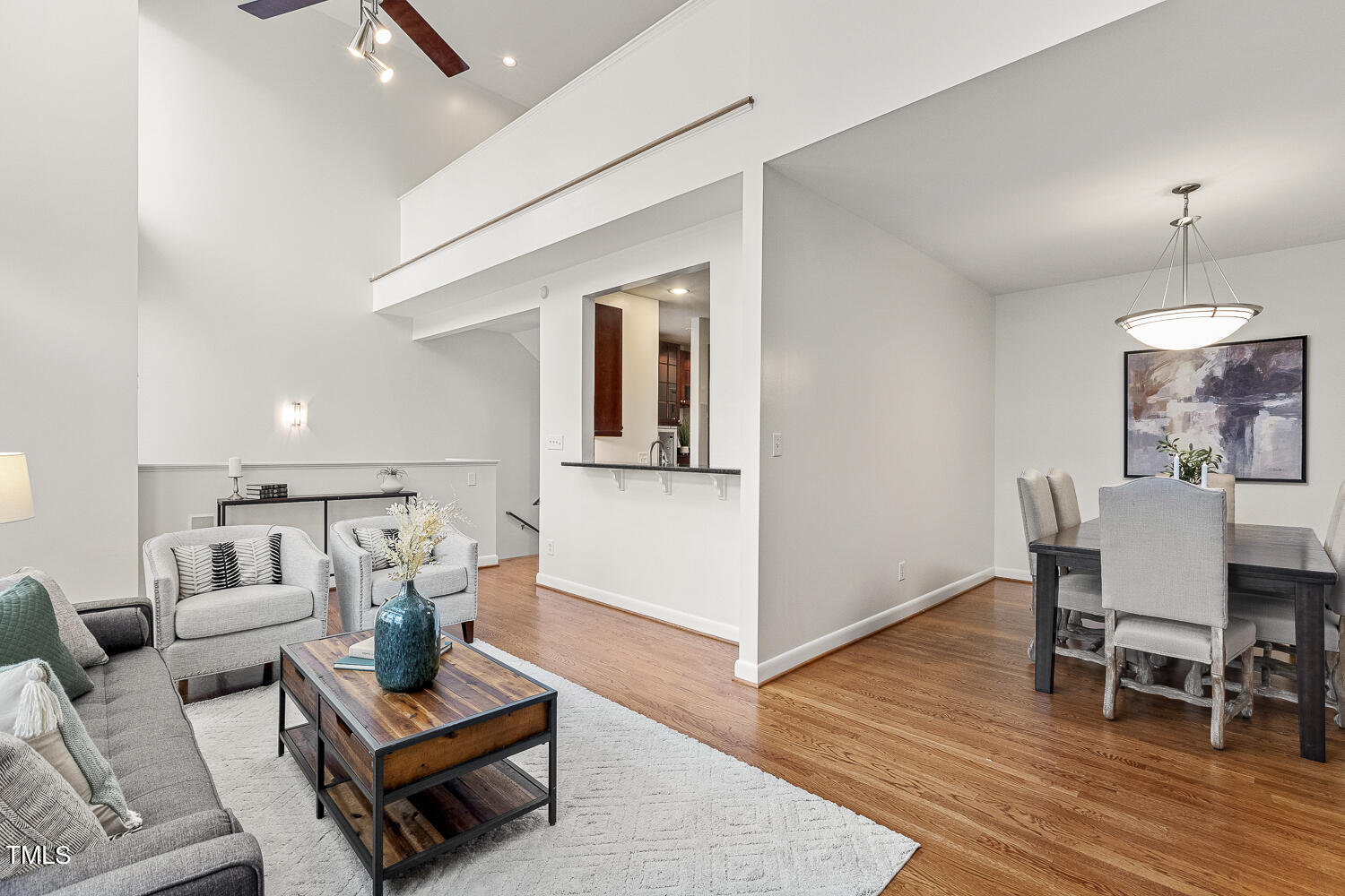 805 The Village Circle Raleigh, NC 27615 - Photo 8 of 42 a living room with furniture and wooden floor