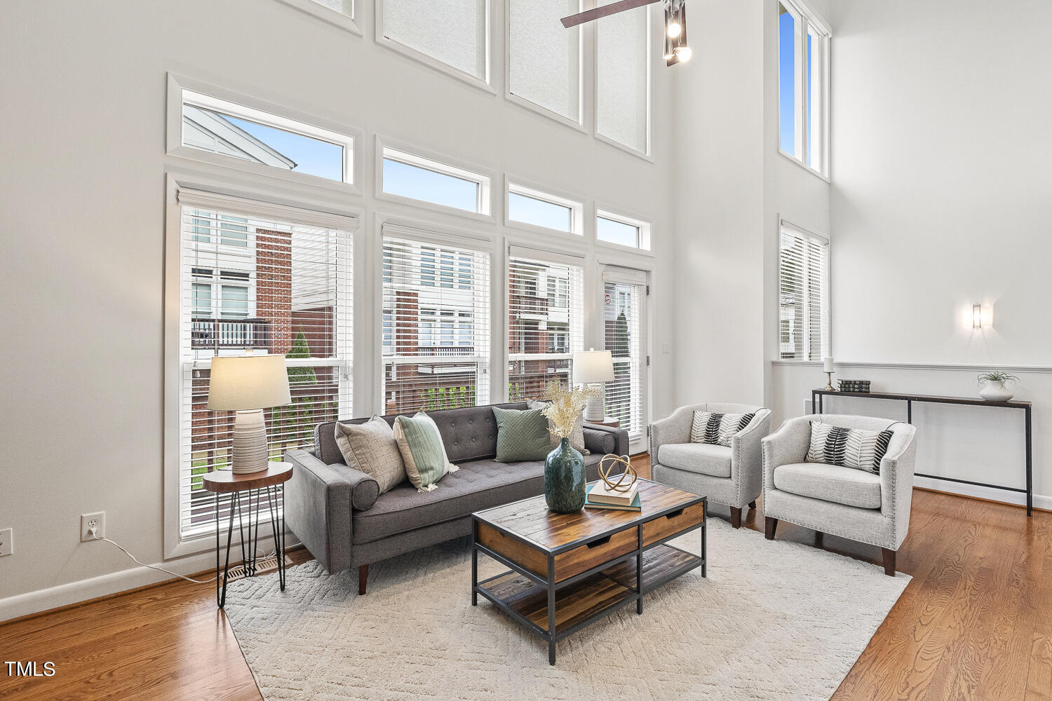 805 The Village Circle Raleigh, NC 27615 - Photo 9 of 42 a living room with furniture and a large window