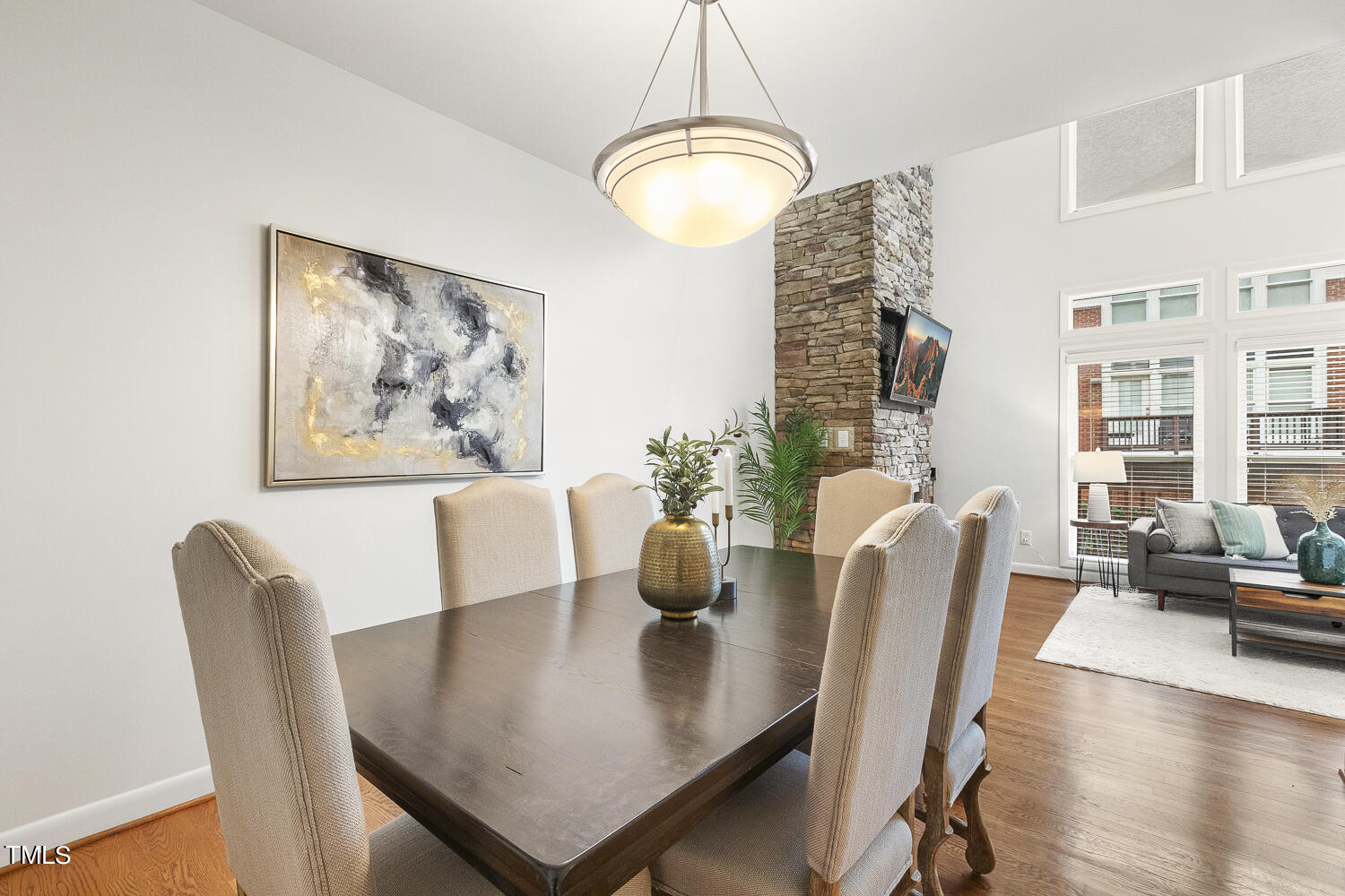 805 The Village Circle Raleigh, NC 27615 - Photo 10 of 42 a view of a dining room with furniture and wooden floor