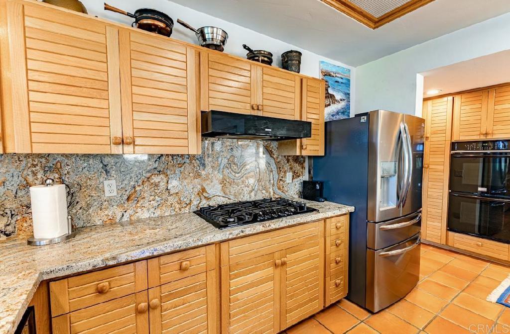 28743 Lebanon Road Pine Valley, CA 91962 - Photo 21 of 46 a kitchen with stainless steel appliances granite countertop a stove a sink and a refrigerator