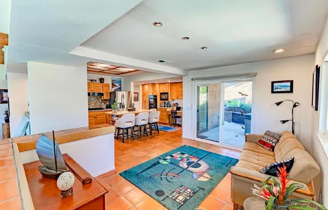 a living room with furniture and a rug