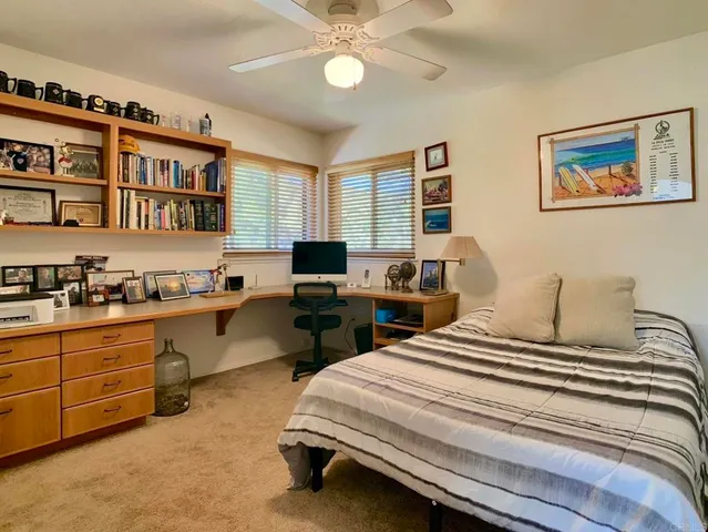 a bedroom with a bed and a cabinets