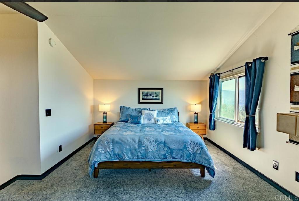 28743 Lebanon Road Pine Valley, CA 91962 - Photo 33 of 46 a bedroom with a bed a mirror on dresser and a window