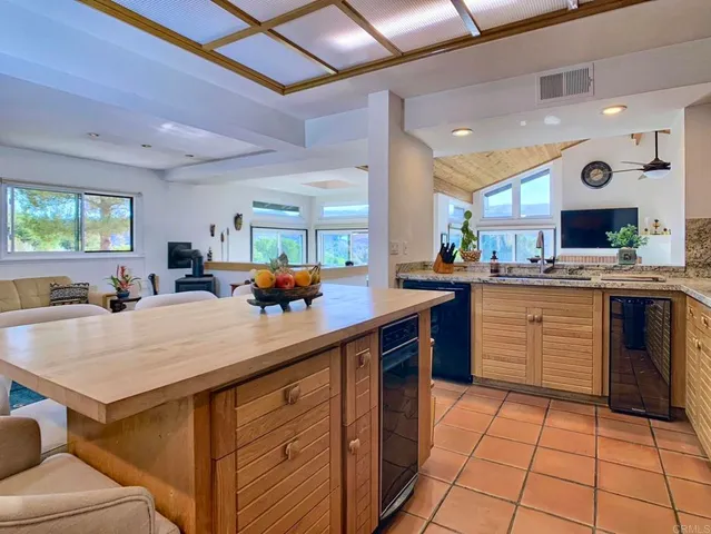 a kitchen with a sink appliances and cabinets