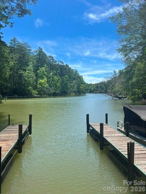 Lot 17-4 North Coast Dr Mill Spring Mill Spring, NC 28756 - Photo 9 of 14 a view of a lake with outdoor seating