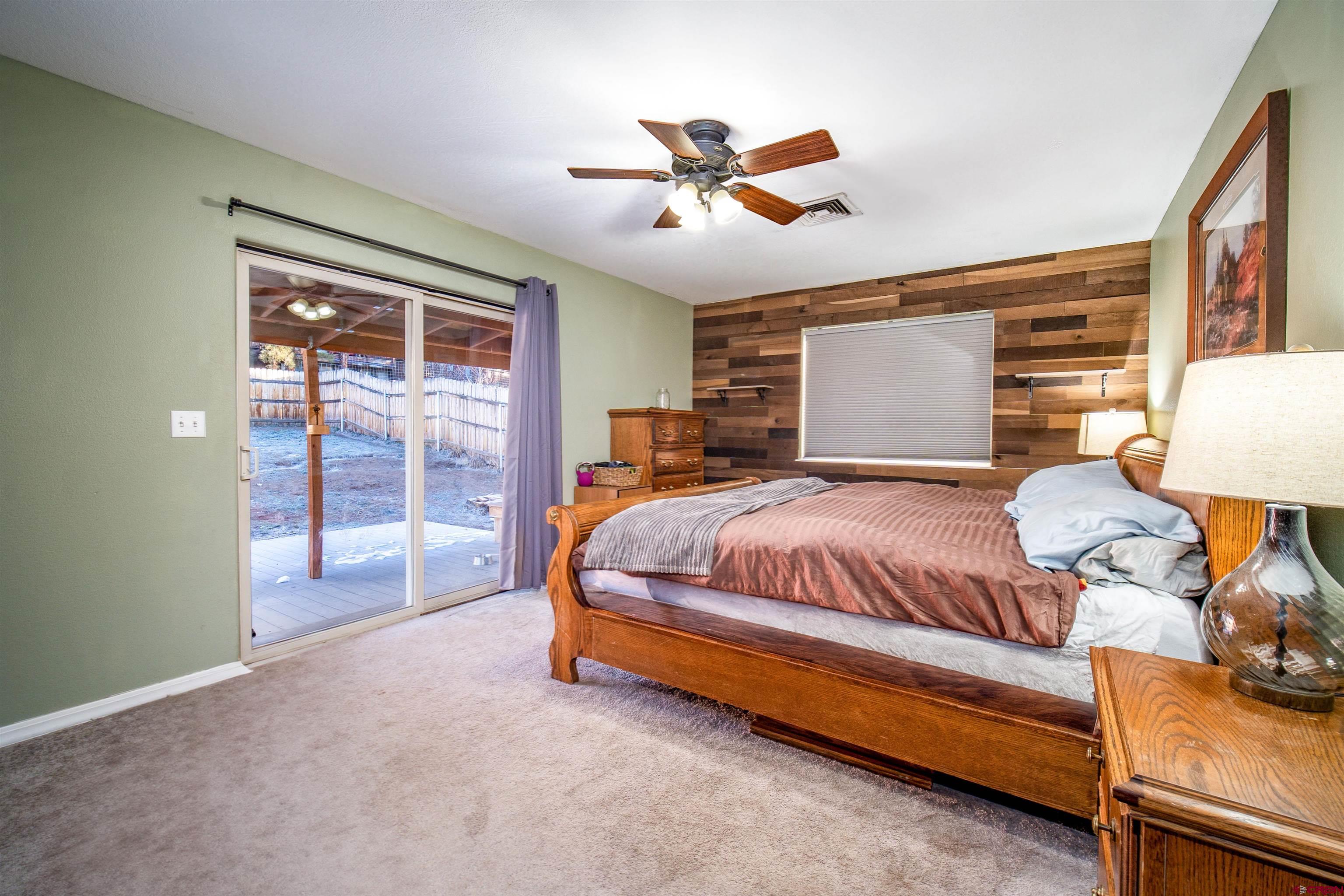 111 Meadowbrook Drive Bayfield, CO 81122 - Photo 11 of 30 a bed room with a bed and a lamp