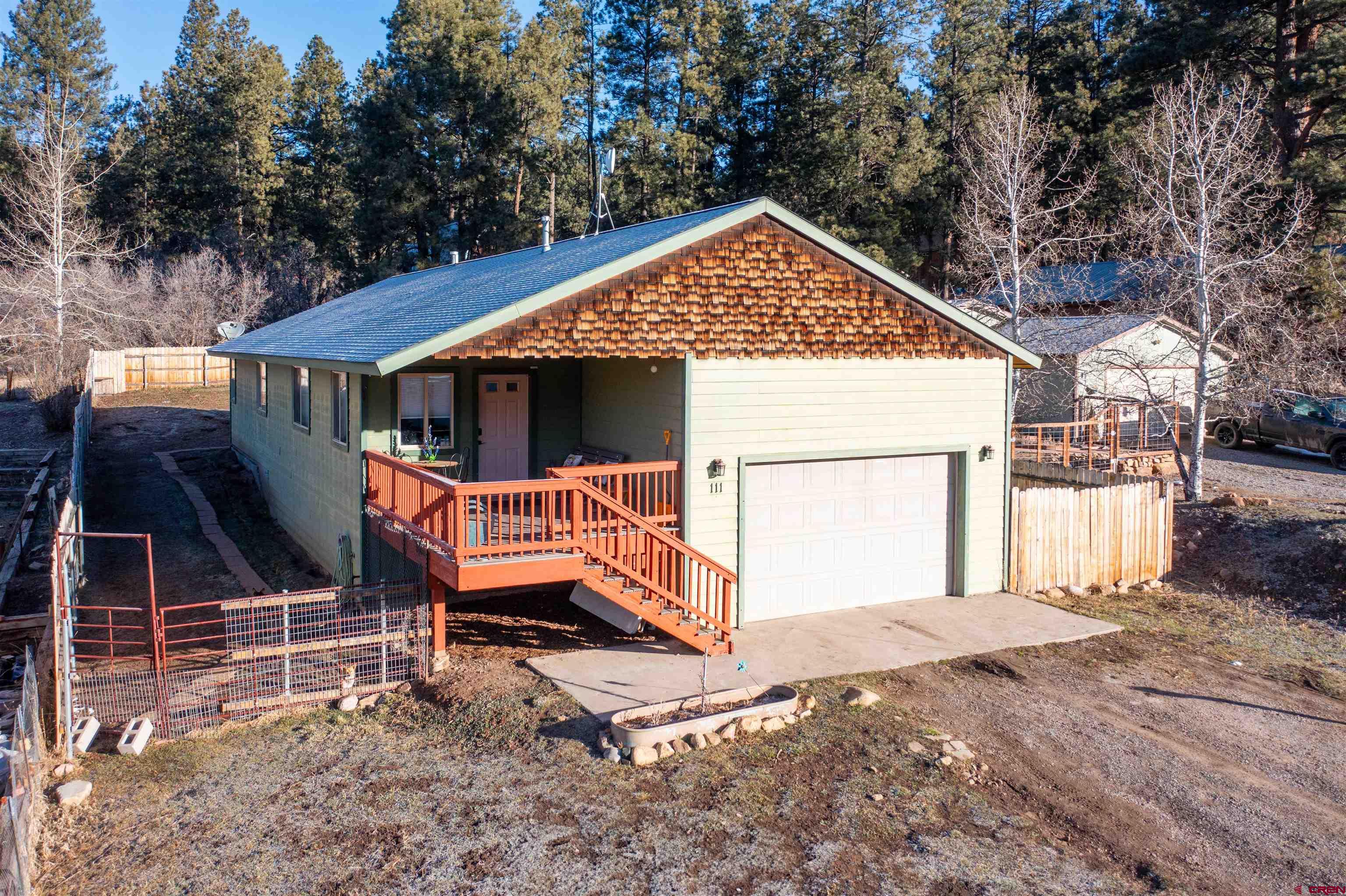 111 Meadowbrook Drive Bayfield, CO 81122 - Photo 18 of 30 a view of a house with a yard