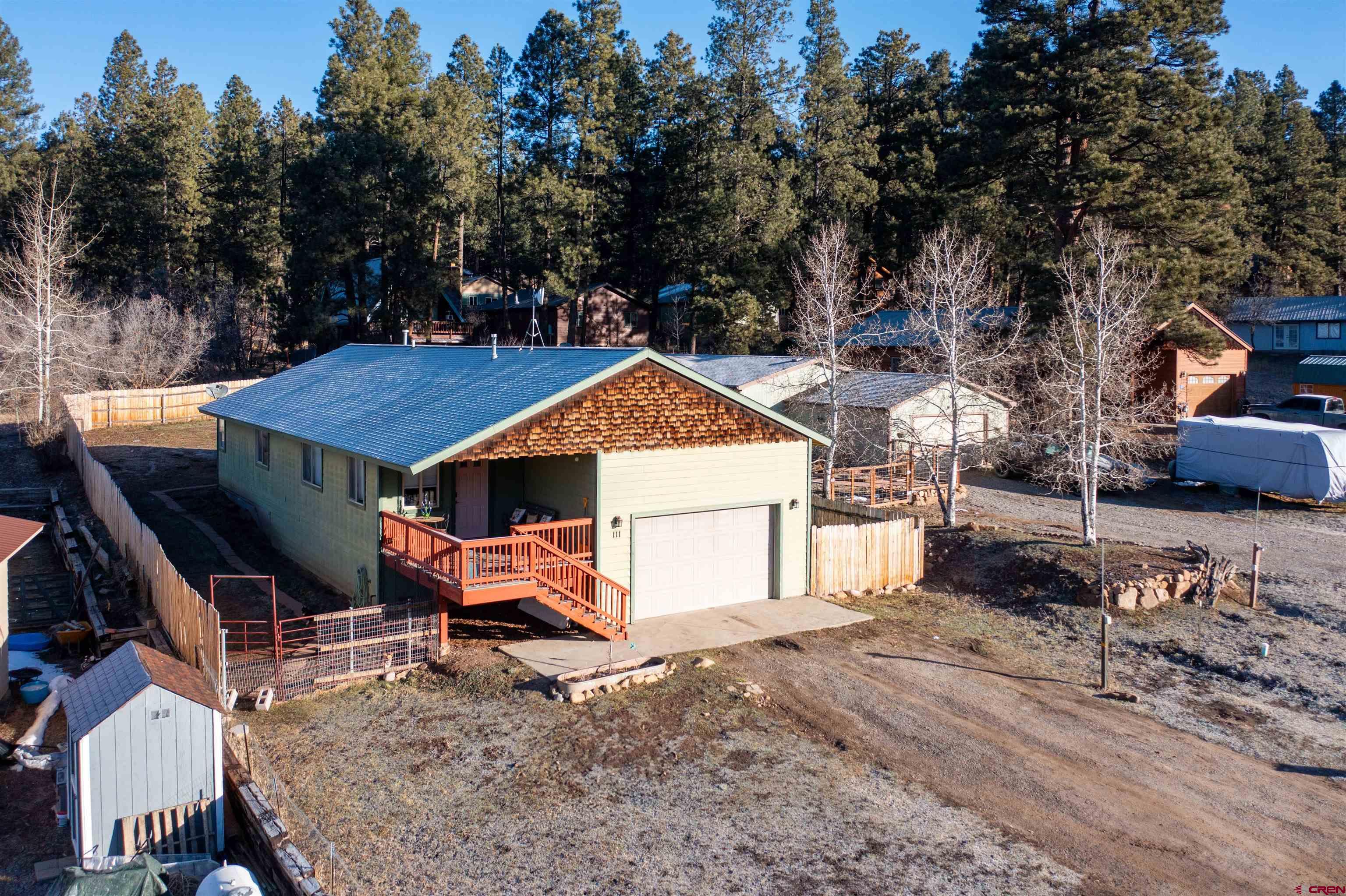 111 Meadowbrook Drive Bayfield, CO 81122 - Photo 19 of 30 an aerial view of a house with a yard patio and wooden fence