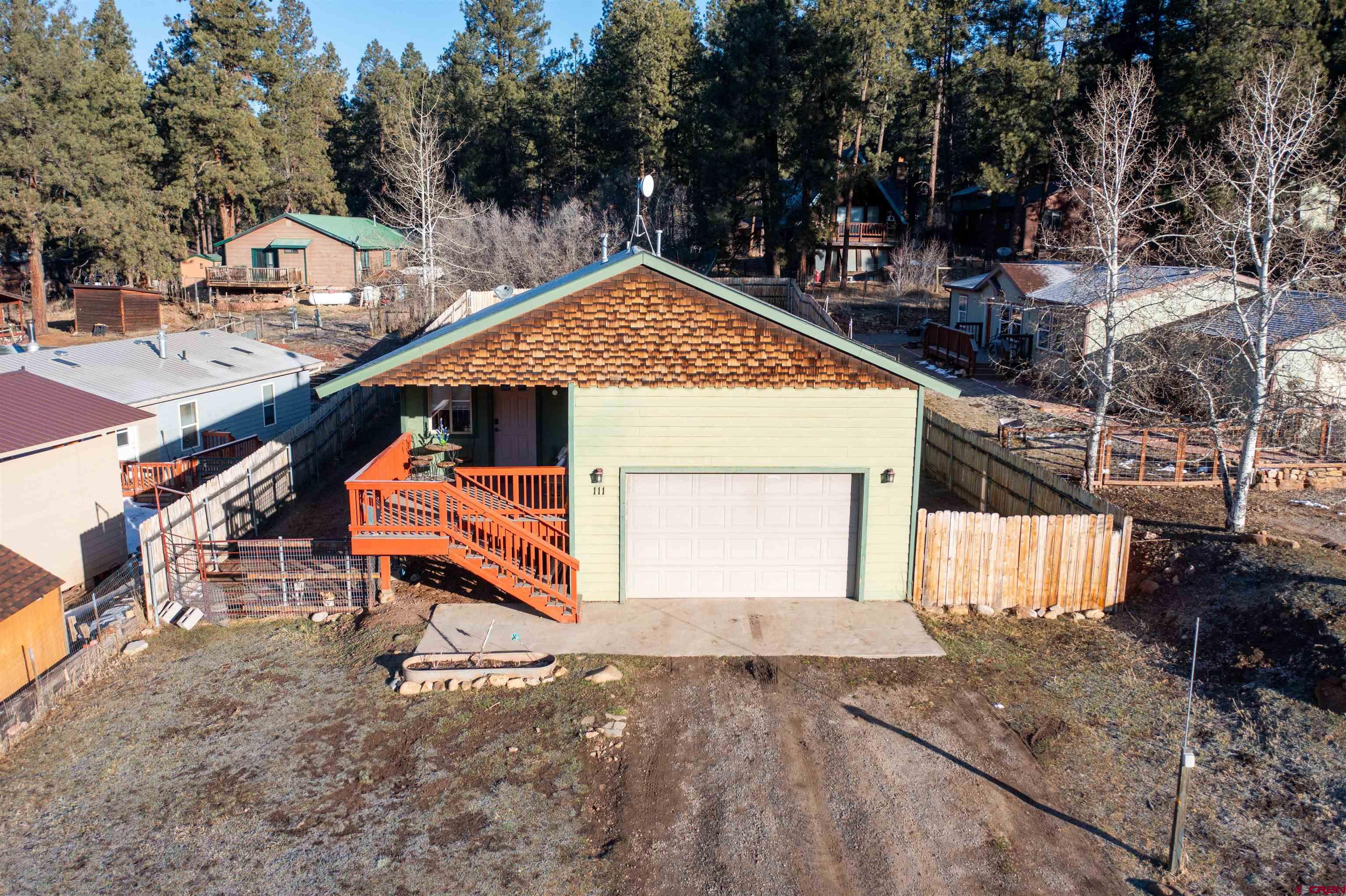 111 Meadowbrook Drive Bayfield, CO 81122 - Photo 25 of 30 a backyard of a house with table and chairs