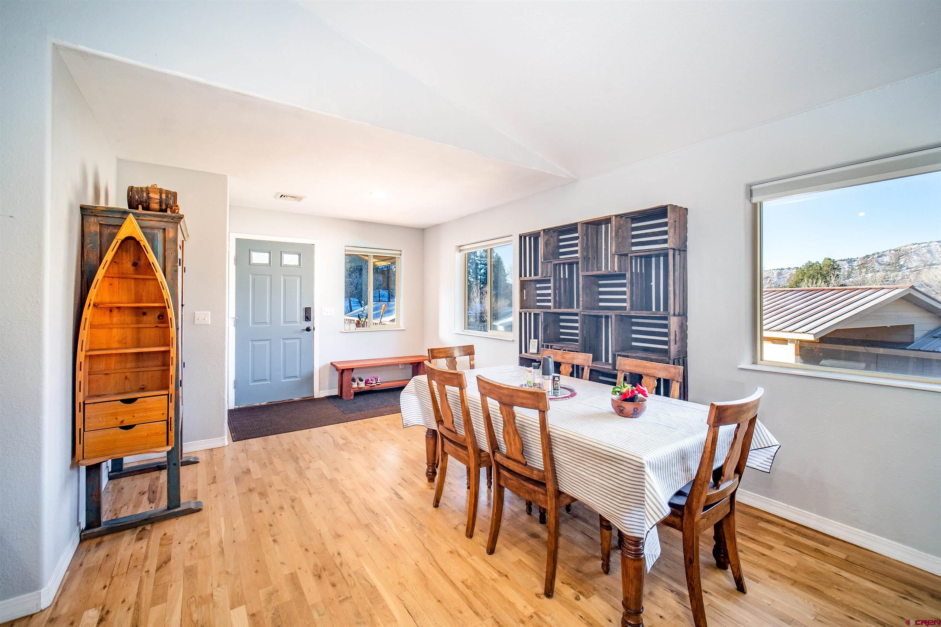 111 Meadowbrook Drive Bayfield, CO 81122 - Photo 7 of 30 a view of a dining room with furniture window and wooden floor