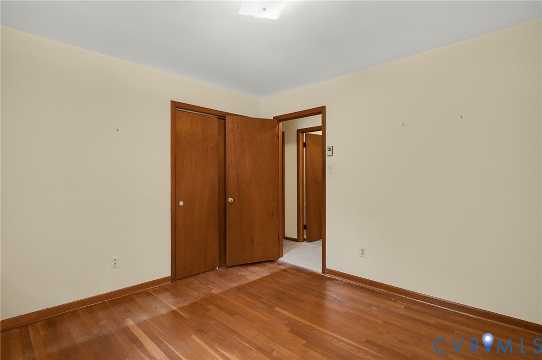 6450 Holborn Road Richmond, VA 23224 - Photo 12 of 20 Unfurnished bedroom with wood finished floors and