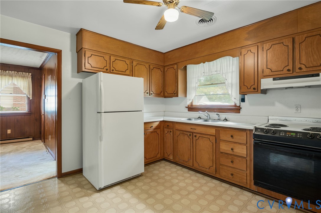 6450 Holborn Road Richmond, VA 23224 - Photo 7 of 20 Kitchen with light floors, electric range, freesta