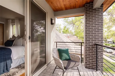 a view of balcony with furniture