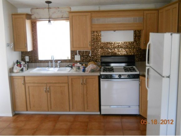 5225 Old Fort Road Rimrock, AZ 86335 - Photo 2 of 6 a kitchen with stainless steel appliances granite countertop a refrigerator sink and stove