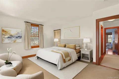a spacious bedroom with a bed and a couch