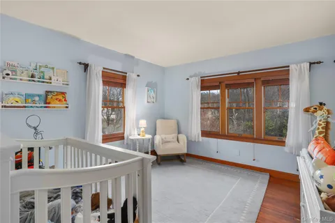 a bedroom with furniture and a window