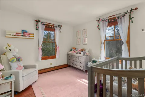 a bedroom with furniture and a window