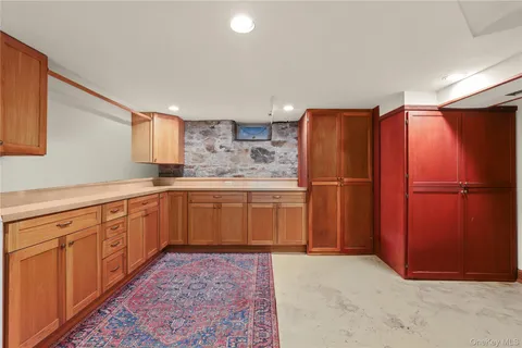 a kitchen with stainless steel appliances granite countertop a refrigerator sink and cabinets