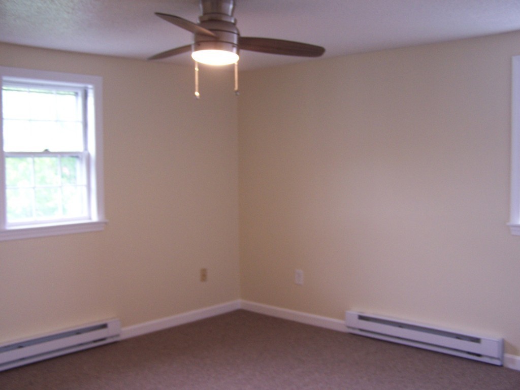 75 Cabot Street, Unit 13 Beverly, MA 01915 - Photo 11 of 13 an empty room with a window