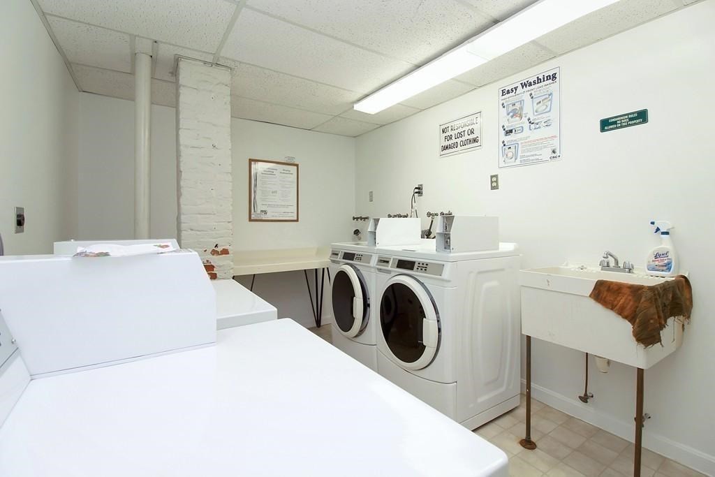 75 Cabot Street, Unit 13 Beverly, MA 01915 - Photo 13 of 13 a utility room with dryer and washer