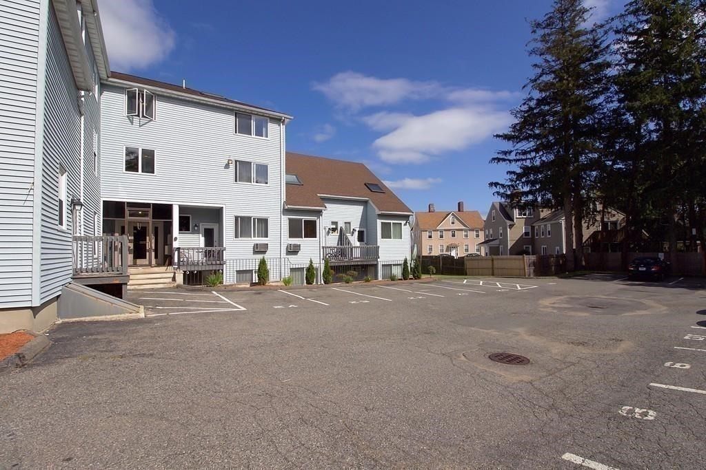 75 Cabot Street, Unit 13 Beverly, MA 01915 - Photo 3 of 13 a view of a building with a street