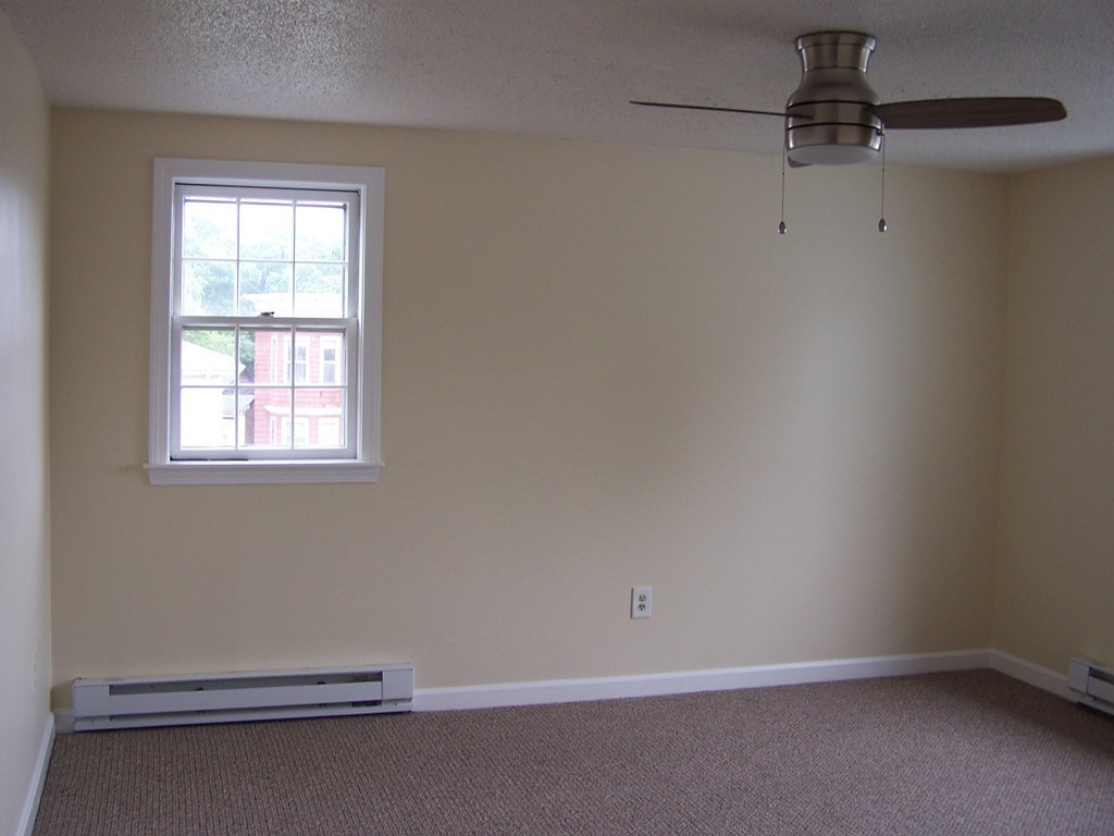 75 Cabot Street, Unit 13 Beverly, MA 01915 - Photo 8 of 13 an empty room with a window
