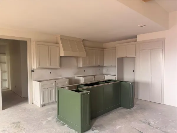 a kitchen with stainless steel appliances granite countertop a sink and a refrigerator