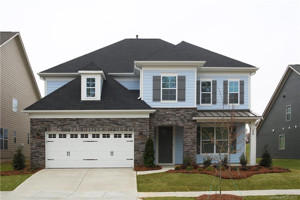 980 Emory Lane, Unit 112 Fort Mill, SC 29708 - Photo 1 of 23 a front view of a house with a yard