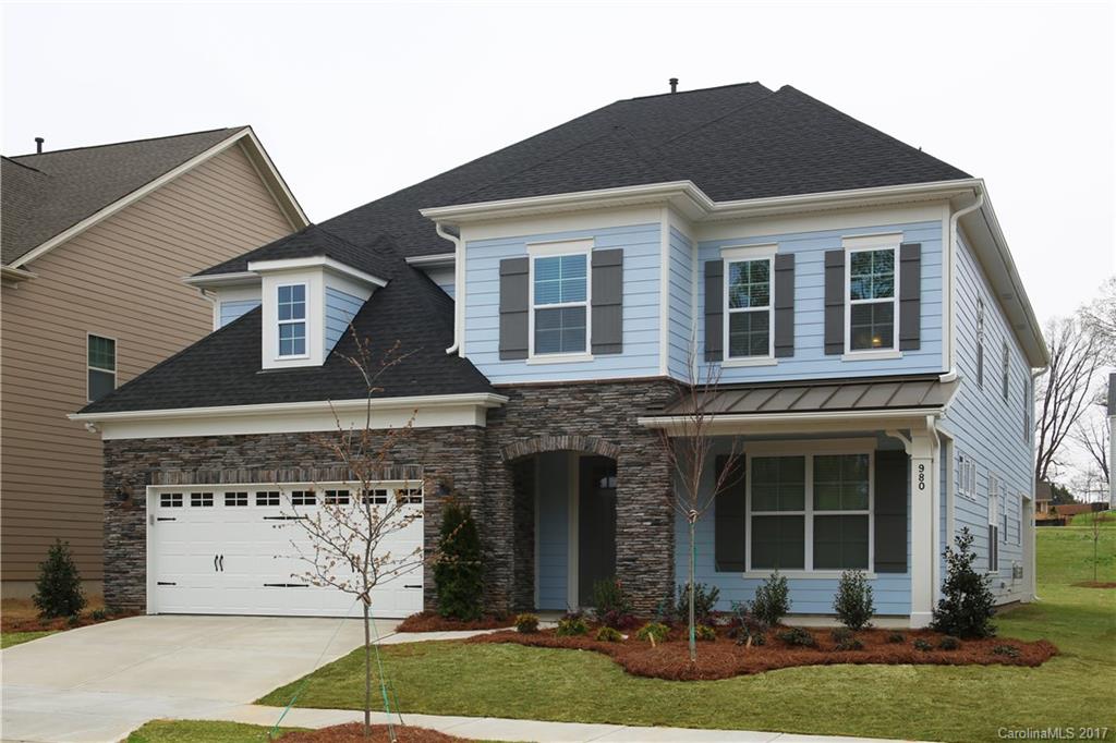980 Emory Lane, Unit 112 Fort Mill, SC 29708 - Photo 2 of 23 a front view of a house with garden