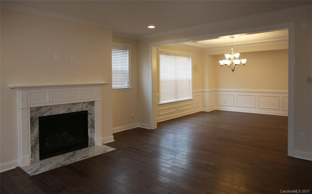 980 Emory Lane, Unit 112 Fort Mill, SC 29708 - Photo 11 of 23 a view of a livingroom with wooden floor a fireplace and window