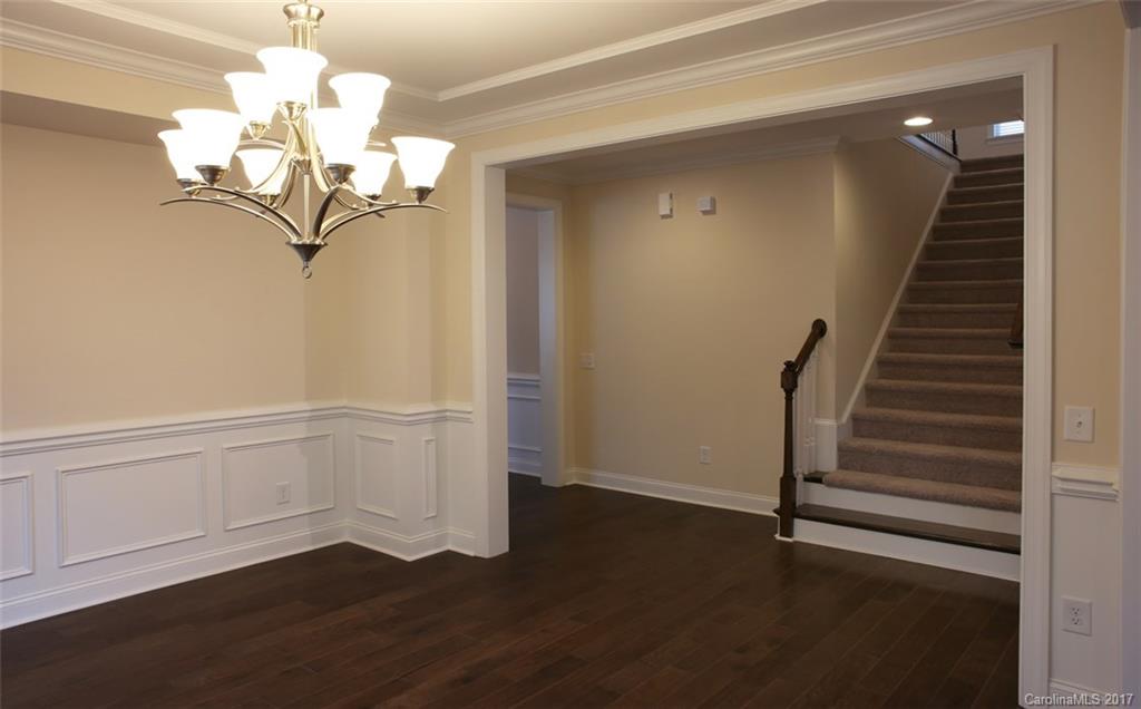 980 Emory Lane, Unit 112 Fort Mill, SC 29708 - Photo 13 of 23 a view of a hallway with wooden floor and staircase