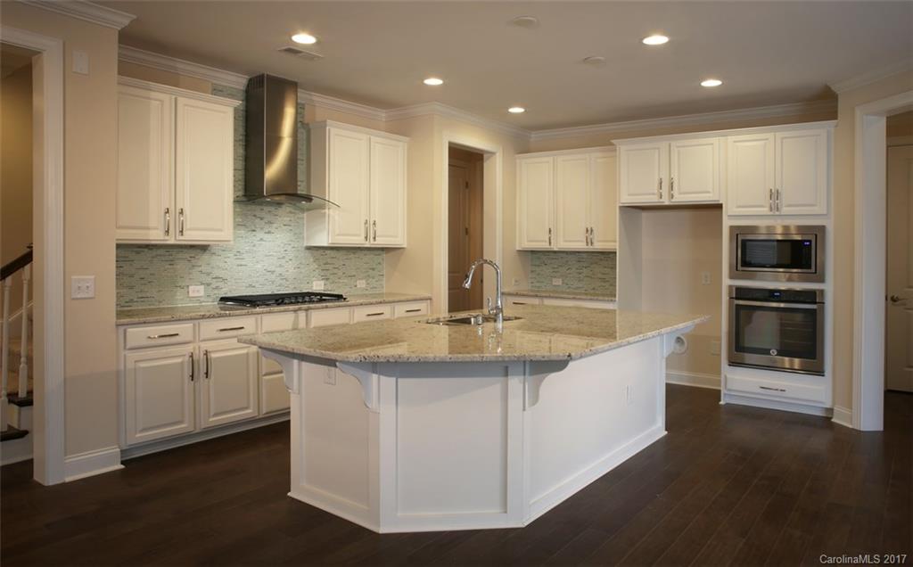 980 Emory Lane, Unit 112 Fort Mill, SC 29708 - Photo 3 of 23 a kitchen with stainless steel appliances granite countertop a sink a stove and a refrigerator