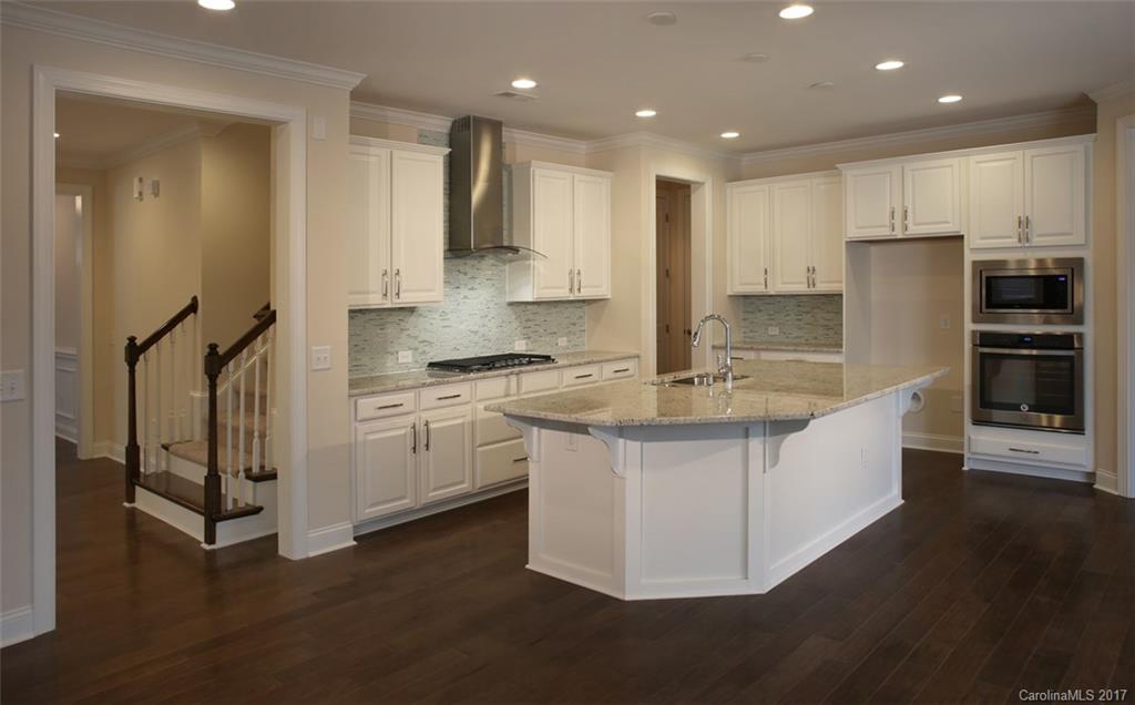 980 Emory Lane, Unit 112 Fort Mill, SC 29708 - Photo 5 of 23 a kitchen with stainless steel appliances granite countertop a stove a sink and a refrigerator