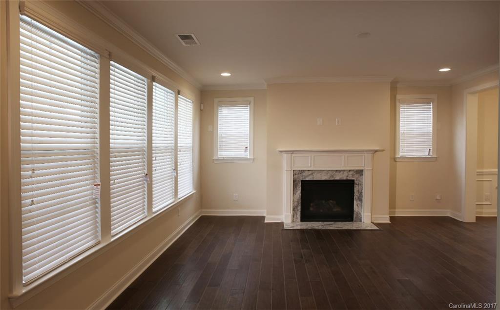 980 Emory Lane, Unit 112 Fort Mill, SC 29708 - Photo 10 of 23 a view of an empty room with wooden floor and a window