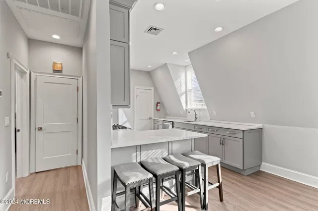 a kitchen with stainless steel appliances a stove microwave and a refrigerator