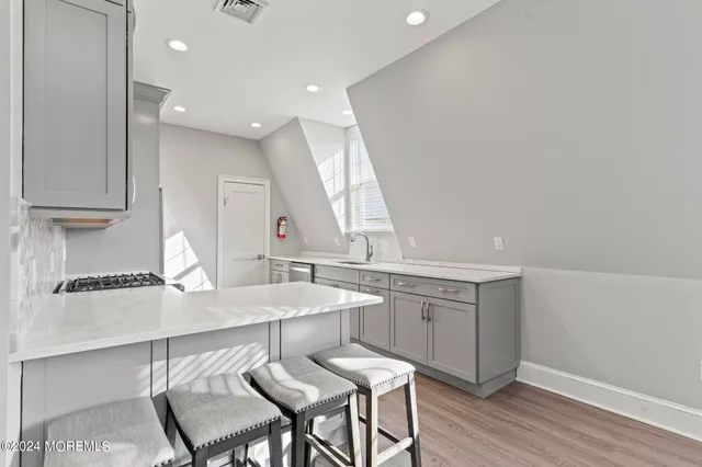 a bathroom with a double vanity sink and a window