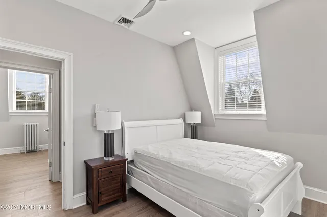 a room with a bed and a view of bedroom