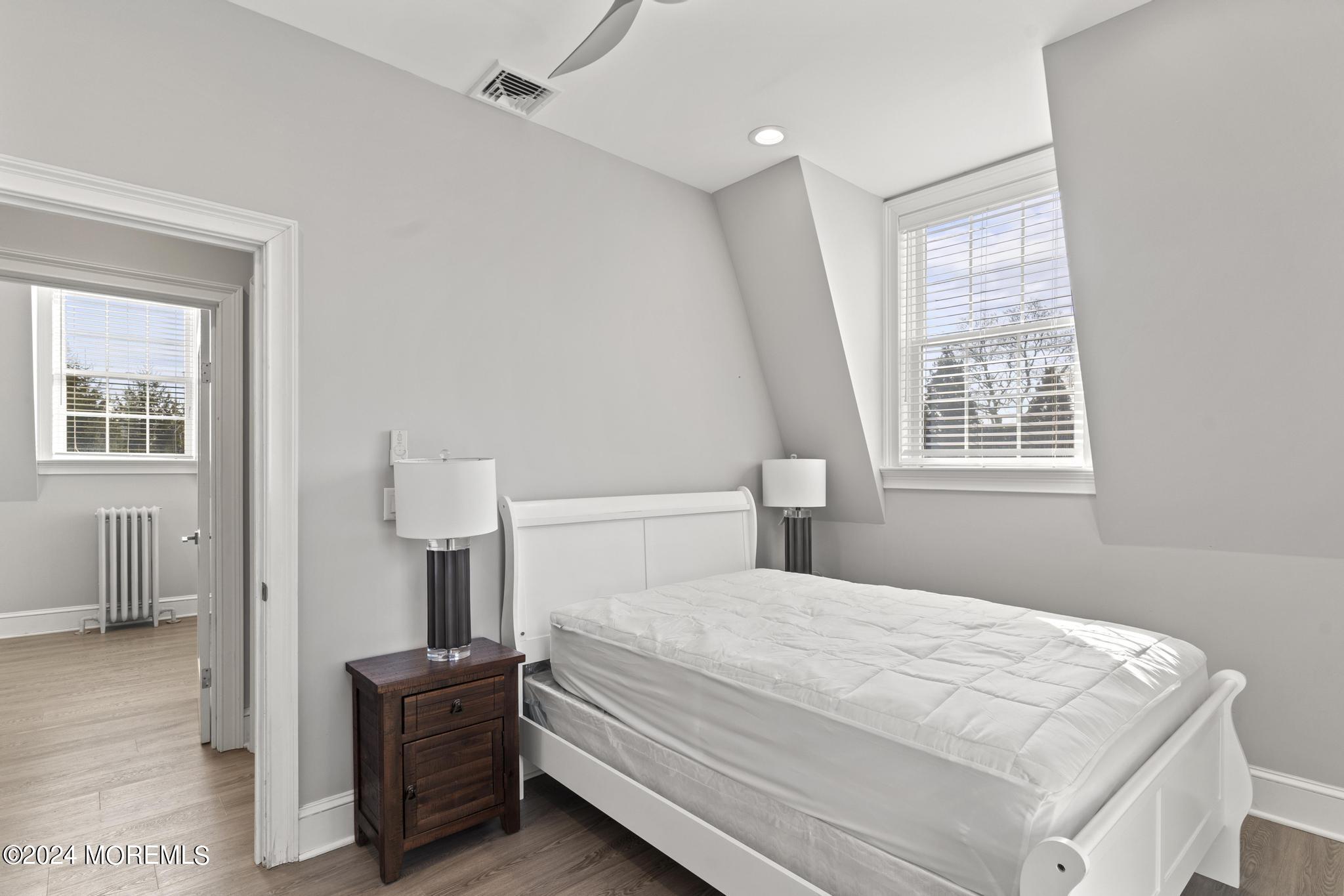 892 Elberon Avenue Long Branch, NJ 07740 - Photo 23 of 50 a bedroom with a bed and a window