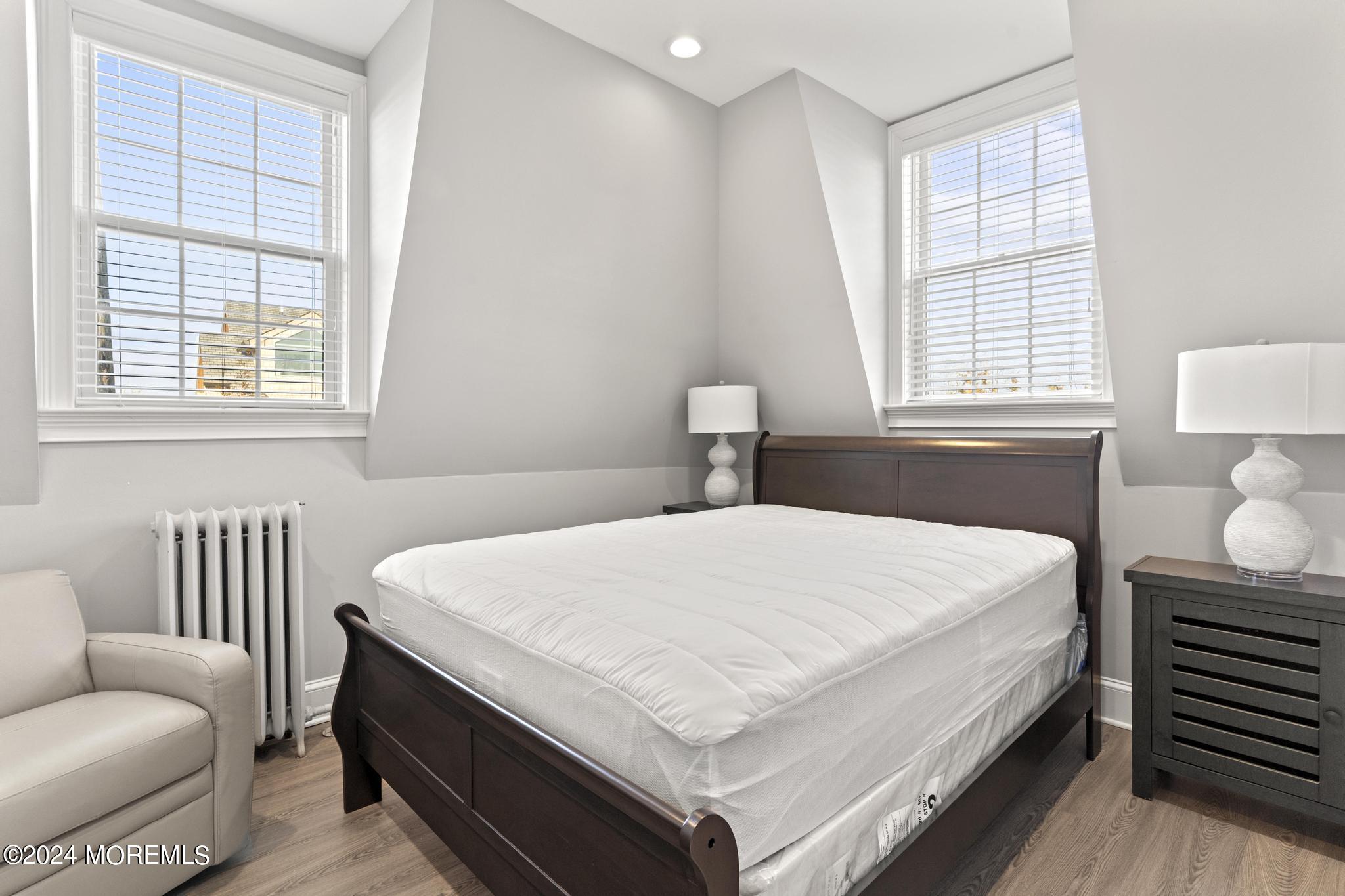 892 Elberon Avenue Long Branch, NJ 07740 - Photo 25 of 50 a bedroom with a bed and a couch