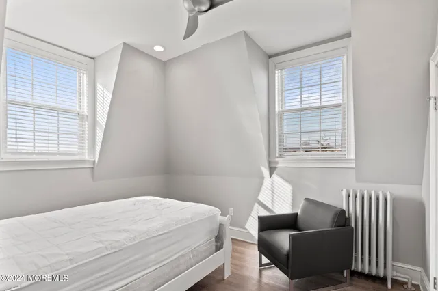 a bedroom with a bed and a lamp