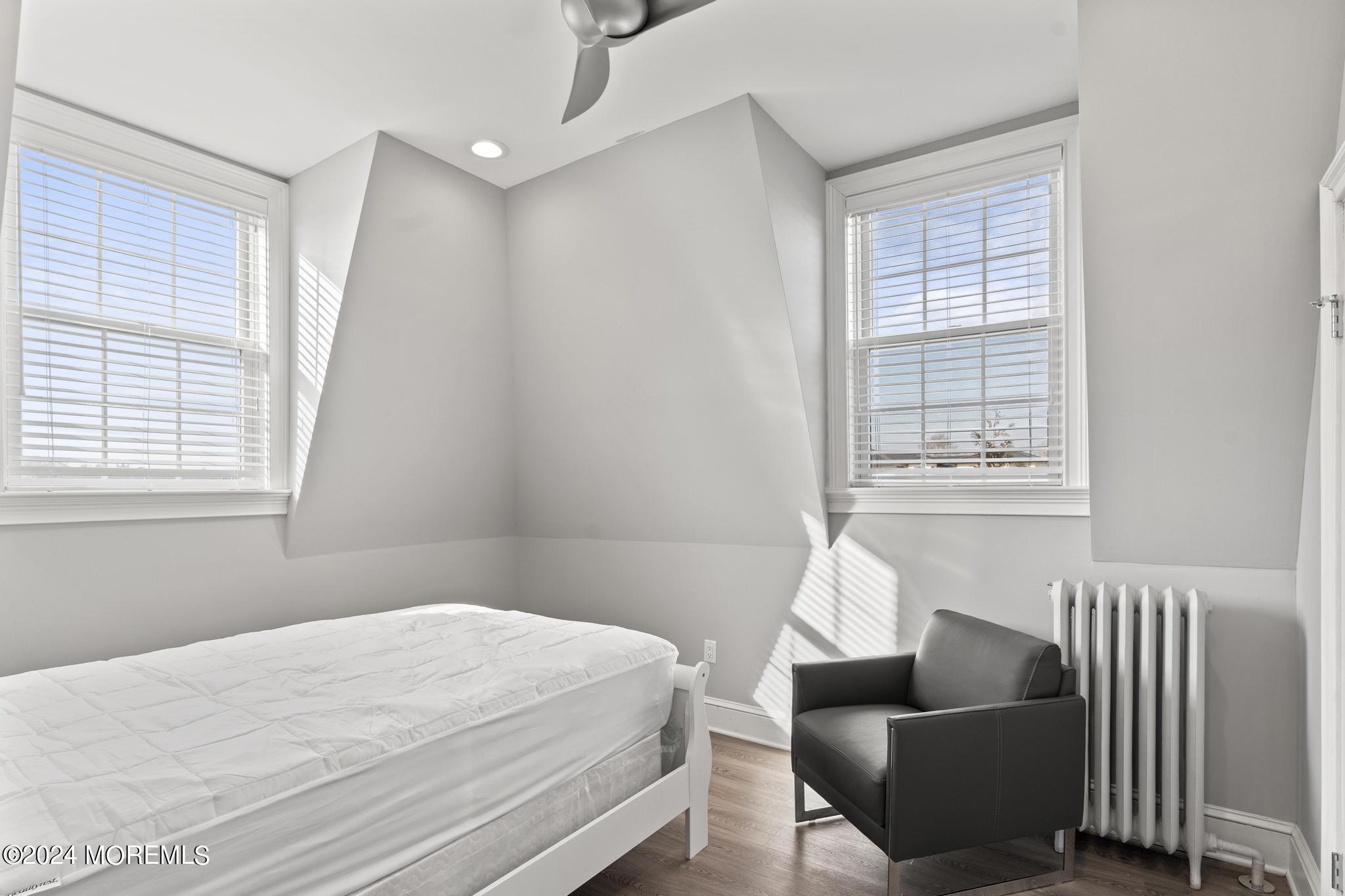 892 Elberon Avenue Long Branch, NJ 07740 - Photo 29 of 50 a bedroom with bed couch and window