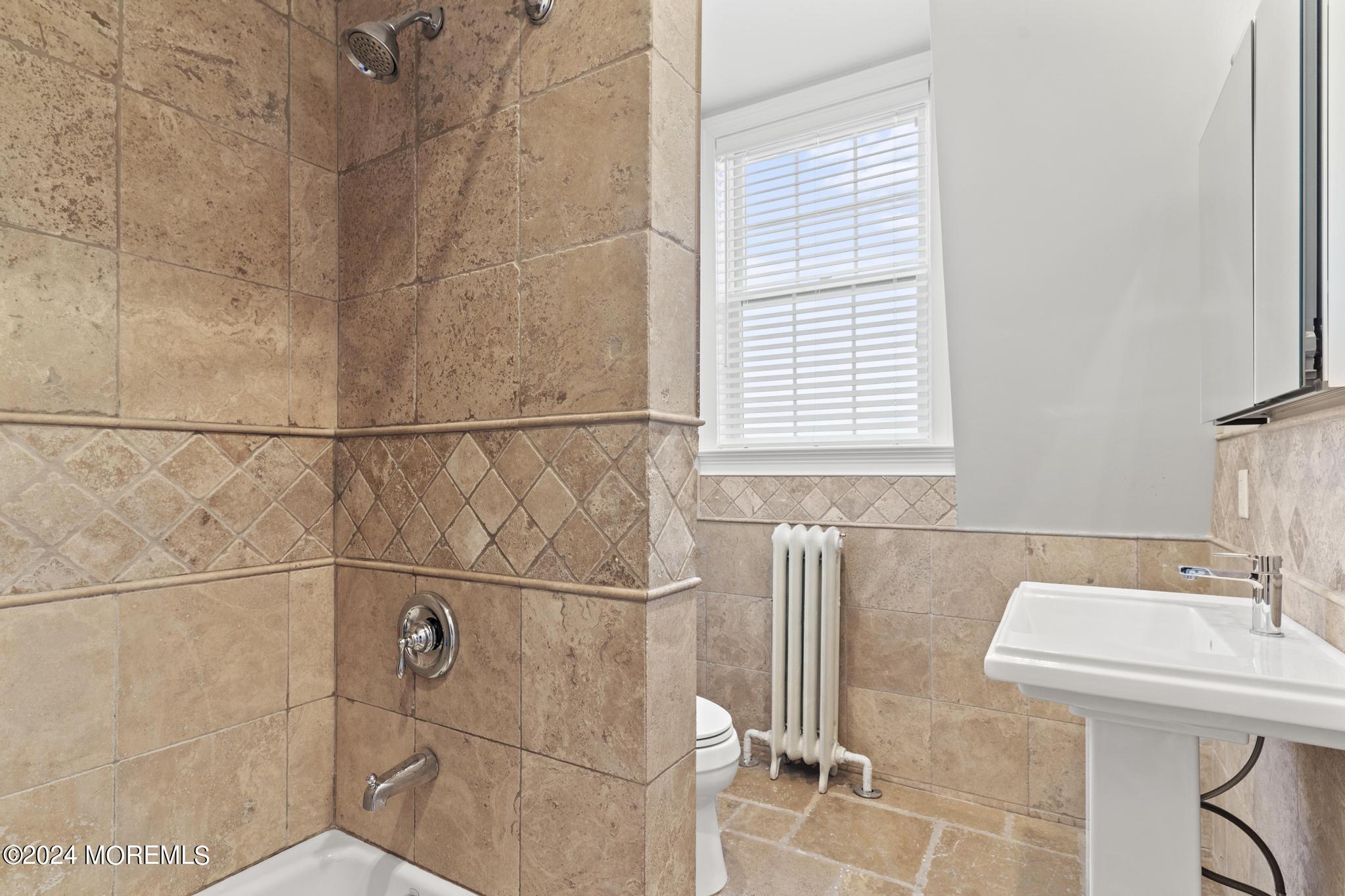 892 Elberon Avenue Long Branch, NJ 07740 - Photo 30 of 50 a bathroom with a sink and a window