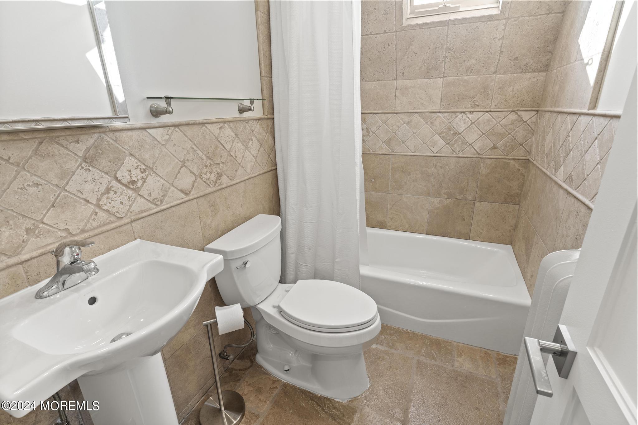 892 Elberon Avenue Long Branch, NJ 07740 - Photo 32 of 50 a bathroom with a sink and a toilet