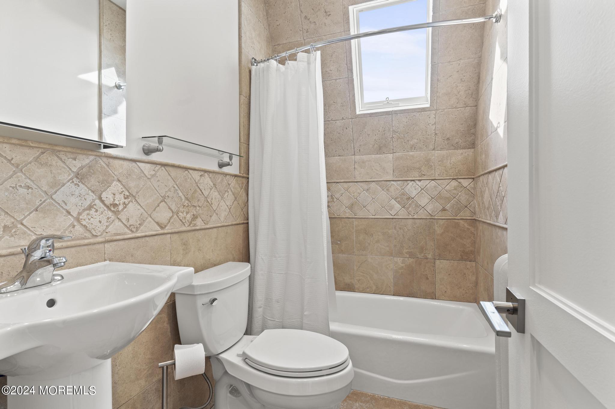 892 Elberon Avenue Long Branch, NJ 07740 - Photo 33 of 50 a bathroom with a sink toilet and shower