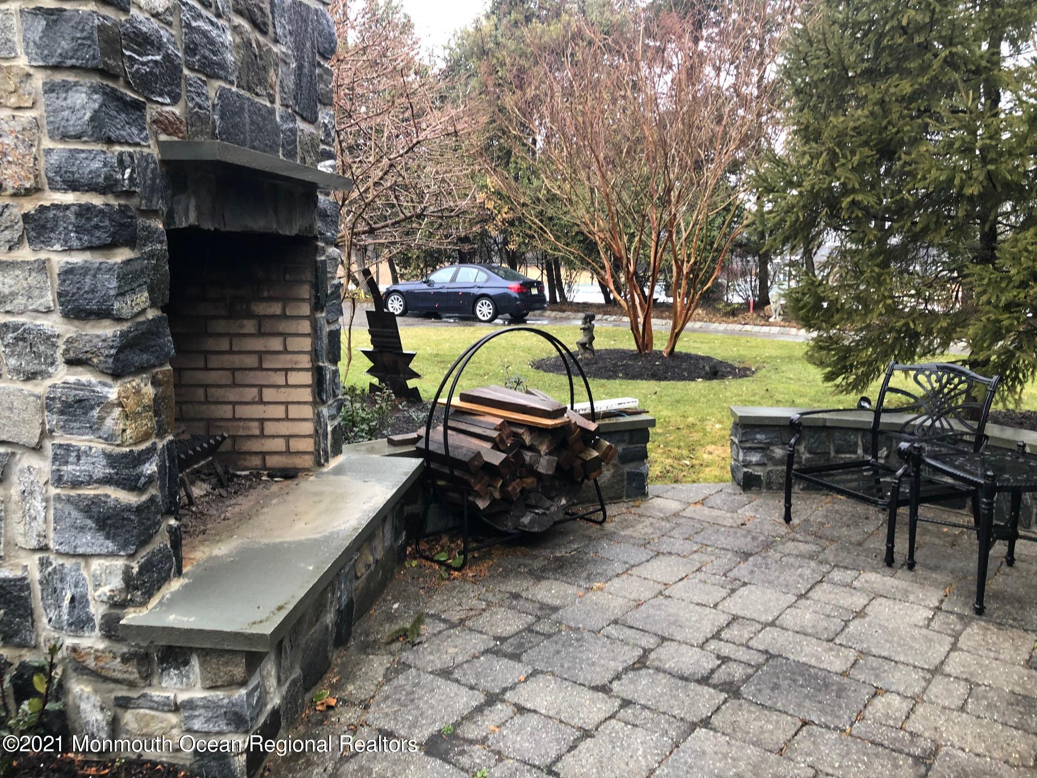 892 Elberon Avenue Long Branch, NJ 07740 - Photo 36 of 50 a backyard of a house with table and chairs
